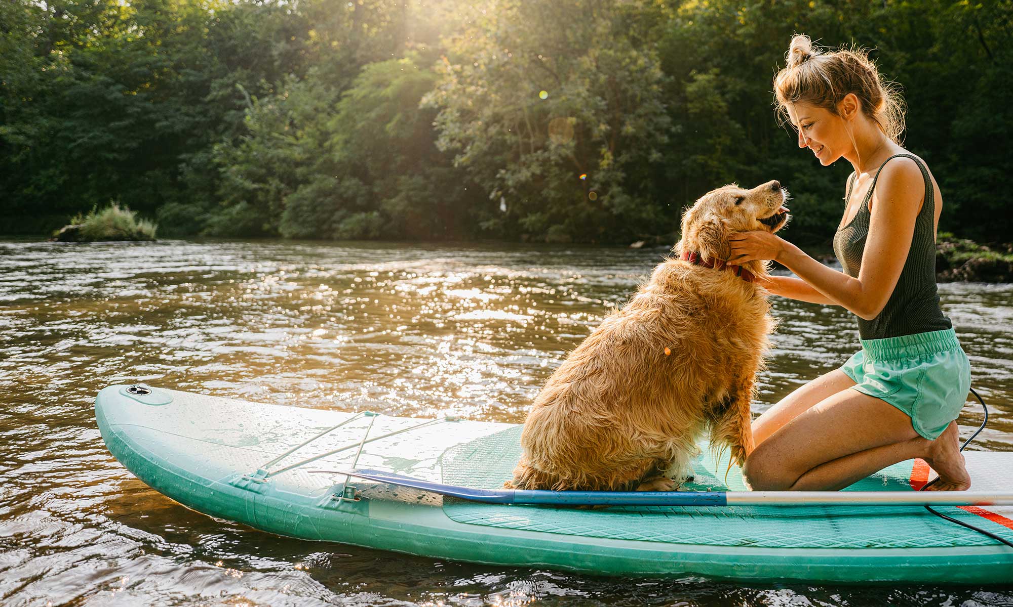 A woman with her golden retriever companion